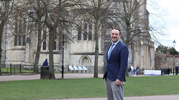 Danny in front of Winchester Cathedral