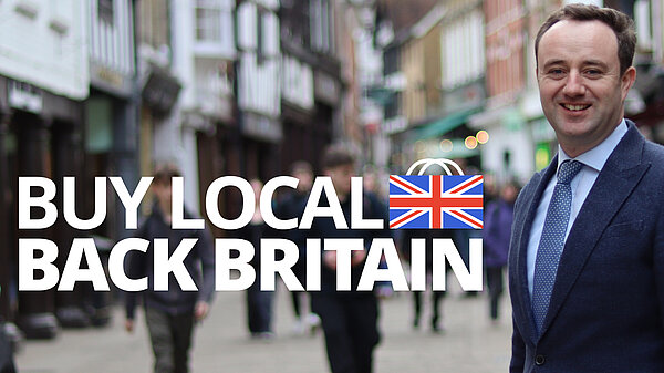 Danny on Winchester High Street with the Buy Local; Back Britain slogan