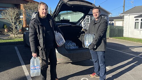 Danny and Jerry Pett with water